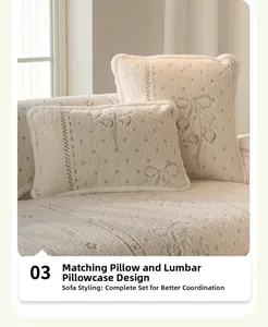 Matching cream white plush pillow covers with dark cherry patterns and lamb wool texture