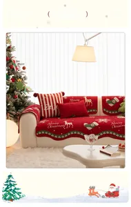 Detailed view of red Christmas chenille sofa cover with reindeer and snowflake patterns