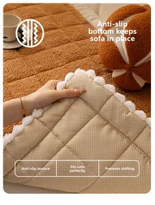 Detailed view of quilted brown plush sofa cushion with non-slip base and pom-pom trim