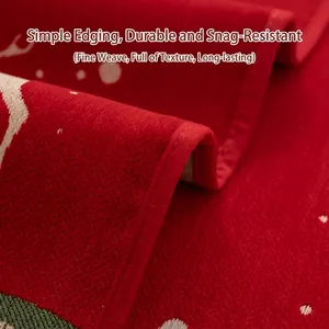 Red Christmas chenille sofa cover with festive jacquard pattern and durable hemmed edges