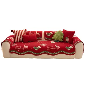Red Christmas Chenille sofa cover featuring white reindeer and snowflake festive patterns