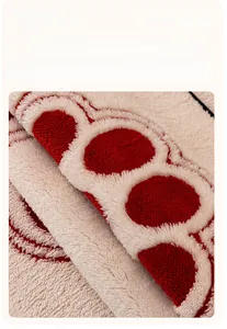 Close-up of premium thick fleece fabric with red polka dots and soft texture