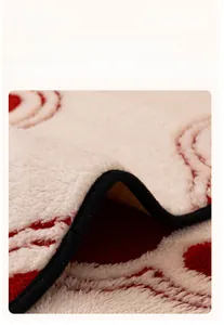 Close-up of plush red and white sofa mat showing thick black edge and non-slip backing