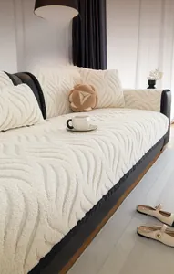 Detail of cream plush sofa cover with high-density wave texture and soft velvet finish