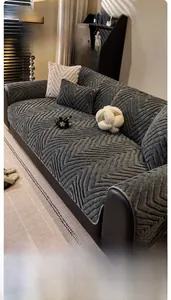 Close-up of grey sherpa sofa cover featuring textured herringbone pattern and soft plush fabric
