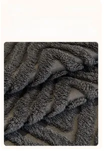 Detail of premium charcoal cotton velvet fabric with a textured wave pattern and plush finish
