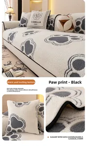 Close-up of thick plush sofa cushion featuring decorative black dog paw prints and piping