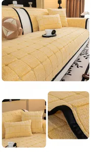 Detail of yellow checkered quilted sofa cover showing thick plush texture and soft fabric