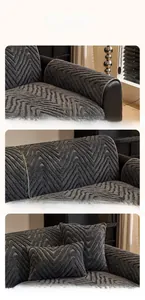 Detail of dark grey plush sofa cover with wave texture showing armrest and cushions