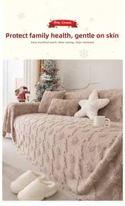 Detail of Christmas plush sofa cover with embossed trees and washable beige fabric
