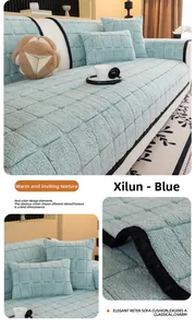 Detail of blue Xilen sofa cover featuring 3D square quilting and black piping edges