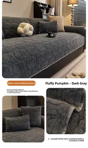 Detail of dark gray plush sofa cover with pumpkin embossed pattern and matching pillow
