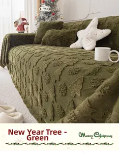 Detail of green plush sofa cover with 3D embossed Christmas trees and snowflakes