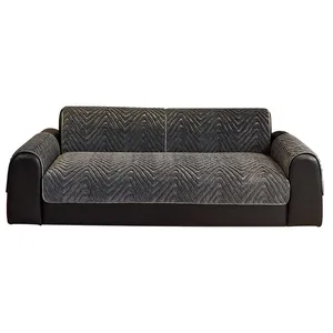 Dark grey minimalist plush sofa cover with herringbone jacquard pattern on leather sofa