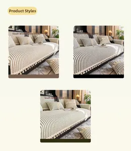 Detailed texture of thick woven sofa cover with decorative tassels in khaki, black and green
