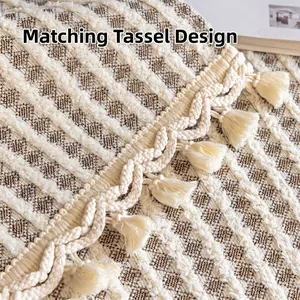 Off-white and mocha geometric knit sofa throw blanket with decorative fringe tassels
