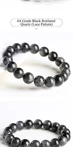 Macro detail of 4A grade lace black rutilated quartz bracelet with polished round beads