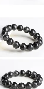 Detail of 2A grade lace black rutilated quartz bracelet with natural crystal inclusions