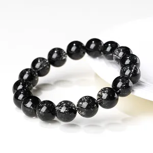 Grade 7A natural black rutilated quartz beaded bracelet with polished stone texture