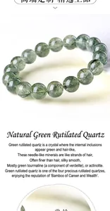 Macro shot of natural green rutilated quartz bracelet with clear beads and needle-like inclusions