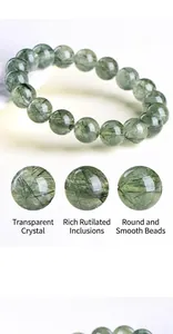 Macro detail of 6A grade natural green rutilated quartz beads with needle inclusions