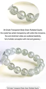 Macro detail of natural green rutilated quartz bracelet showing clear 10mm beads with needles