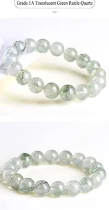 Detailed macro view of 7A grade clear green rutilated quartz beads showing needle-like inclusions