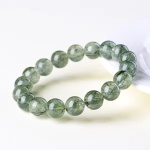 Natural green rutilated quartz bead bracelet with clear crystals and needle-like inclusions