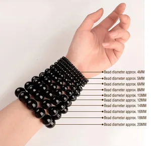 Size comparison of black beads from 4mm to 20mm on model's wrist with 14cm circumference