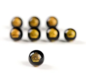 Macro di perle in agata nera lucida con motivi di Buddha dorati per gioielli fai-da-te