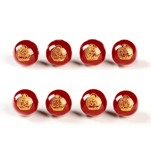 Perle in agata rossa con incisioni dorate di divinità buddiste per gioielli fai da te
