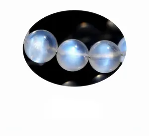 Macro shot of 5A grade cream blue moonstone beads with elegant blue sheen effect
