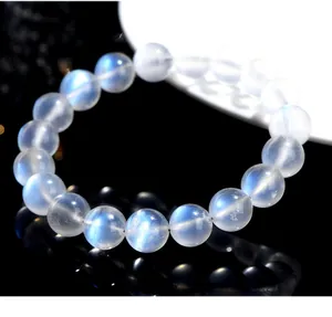 Macro view of blue moonstone beaded bracelet with natural glow and mirror reflection