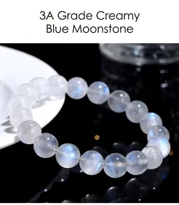 Macro detail of 3A grade cream-toned blue moonstone beads with natural blue sheen