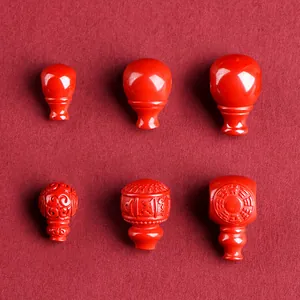 Cuentas y colgantes de cinabrio natural con motivos tradicionales para la creación de joyas