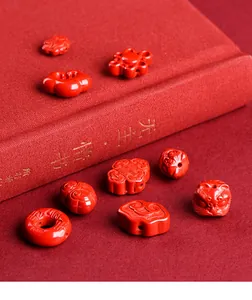 Macro shot of intricately carved cinnabar red beads for DIY jewelry making
