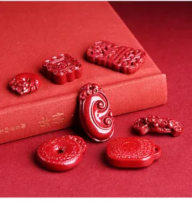 Macro detail of cinnabar pendant set with traditional Chinese relief carvings on red silk
