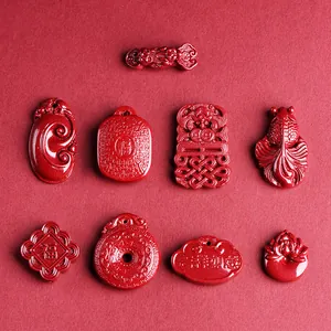 Chinese red cinnabar pendant set with fortune lock, lotus, and koi fish carvings