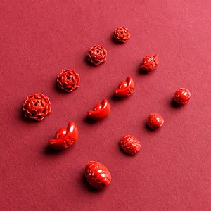 Deep red cinnabar beads featuring lotus and wealth ingot shapes for jewelry making