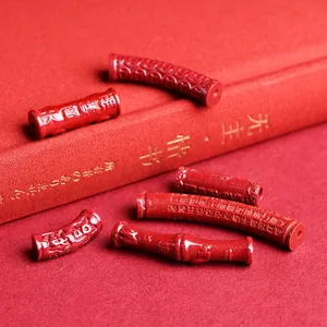 Perles en cinabre rouge gravées d'écritures bouddhistes pour la création de bijoux