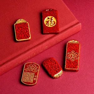 Red cinnabar pendant set with golden carvings of Fu character and Heart Sutra