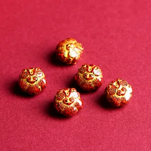 Traditional cinnabar red and gold Chinese lion head beads for DIY jewelry making
