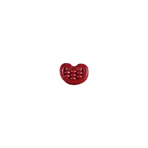 Sparkling pomegranate cinnabar charm with red shimmer and realistic seed pattern detail