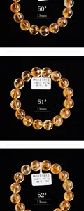 Detailweergave van drie natuurlijke citrien armbanden van 13mm op zwarte achtergrond