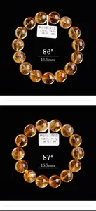 Detail van 15,5mm natuurlijke citrienkwarts kralen met ijskrakeleetextuur op zwart