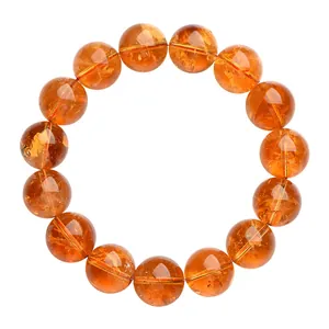 Natuurlijke gele citrien armband 7A met 14 transparante ronde kralen op witte achtergrond