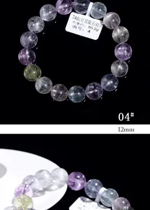 Macro detail of 12mm 7A grade natural kunzite beads with cat eye effect on a plate