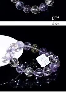 Macro shot of 13mm natural purple cat-eye kunzite beads with clear silky texture