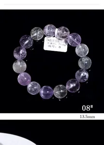 Macro detail of 7A natural cat eye kunzite beads bracelet with 13.5mm diameter