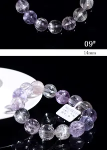 Macro detail of 14mm cat eye kunzite beaded bracelet showing internal silk texture